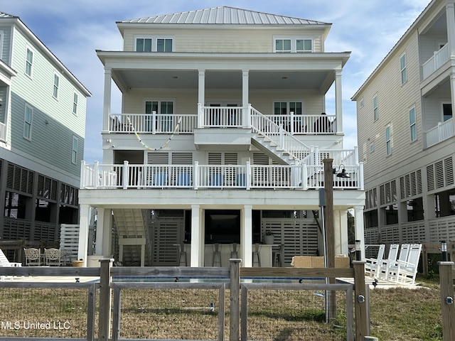 exterior space featuring stairs and metal roof