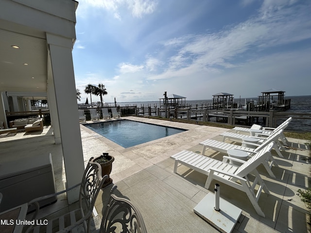 community pool with a patio area