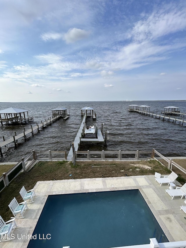 dock area featuring a water view and fence