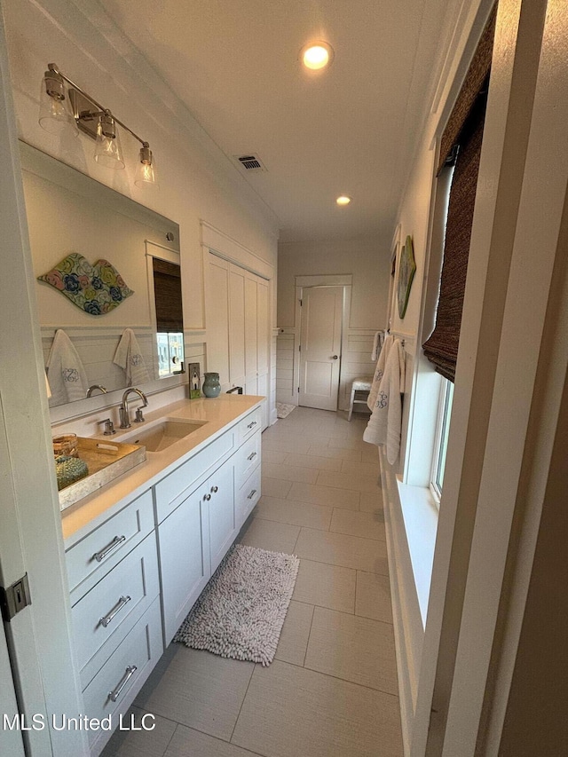 bathroom with tile patterned flooring, visible vents, vanity, and recessed lighting