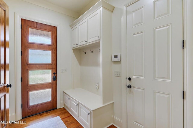 mudroom with light hardwood / wood-style floors