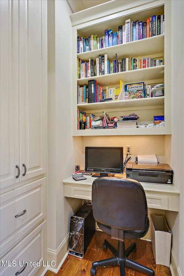 office space with hardwood / wood-style floors