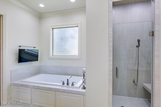 bathroom featuring crown molding and plus walk in shower