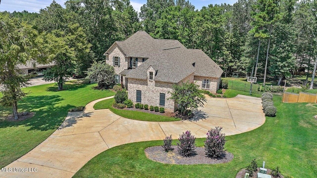 view of front of property with a patio area and a front lawn