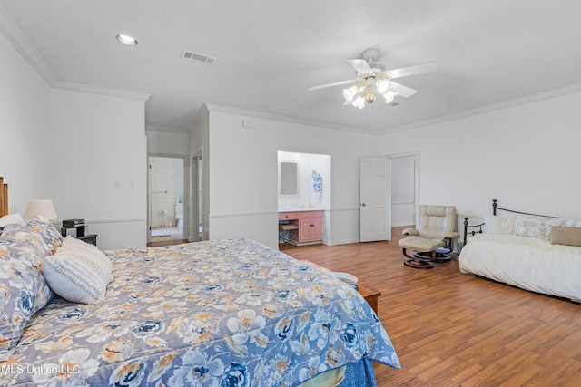 bedroom with crown molding, wood-type flooring, and ceiling fan