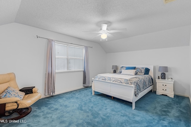 carpeted bedroom with lofted ceiling, a textured ceiling, and ceiling fan