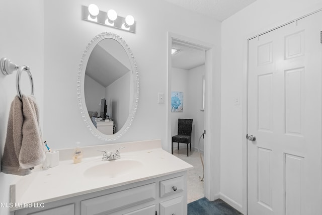 bathroom featuring vanity and a textured ceiling