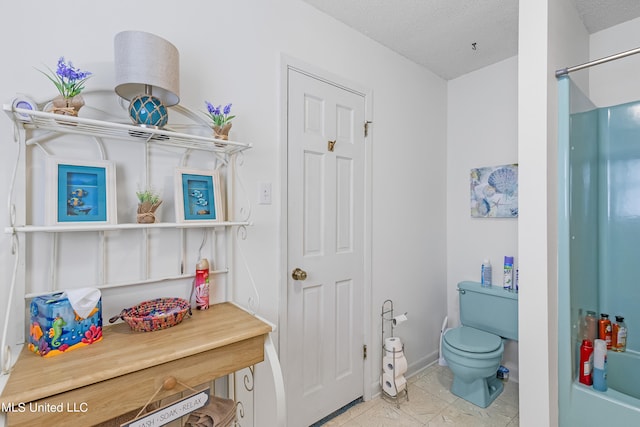 bathroom with toilet, shower / bath combination, a textured ceiling, and tile patterned floors