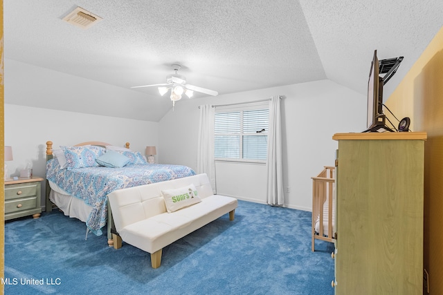 bedroom with a textured ceiling, vaulted ceiling, carpet floors, and ceiling fan