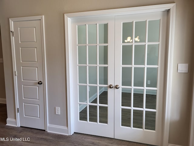 doorway to outside featuring dark wood-type flooring and french doors