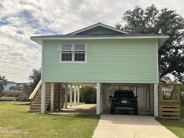 view of side of home featuring a lawn and a carport