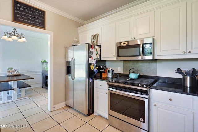 449 Abbey Woods, Brandon, MS 39047 - kitchen featuring stainless steel appliances, white cabinetry, ornamental molding, light tile patterned floors, and a chandelier