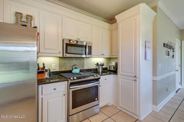 449 Abbey Woods, Brandon, MS 39047 - kitchen featuring appliances with stainless steel finishes, light tile patterned floors, white cabinetry, and crown molding