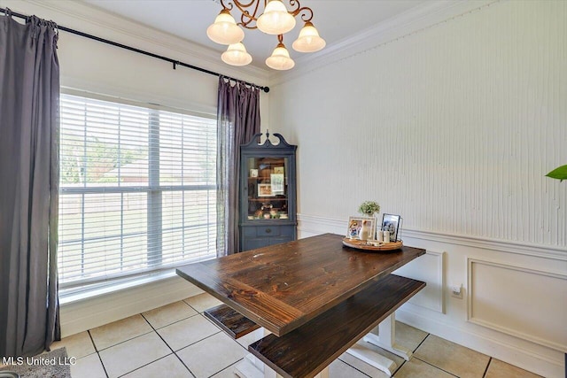 449 Abbey Woods, Brandon, MS 39047 - dining area with light tile patterned floors, a chandelier, crown molding, healthy amount of natural light, and a wainscoted wall