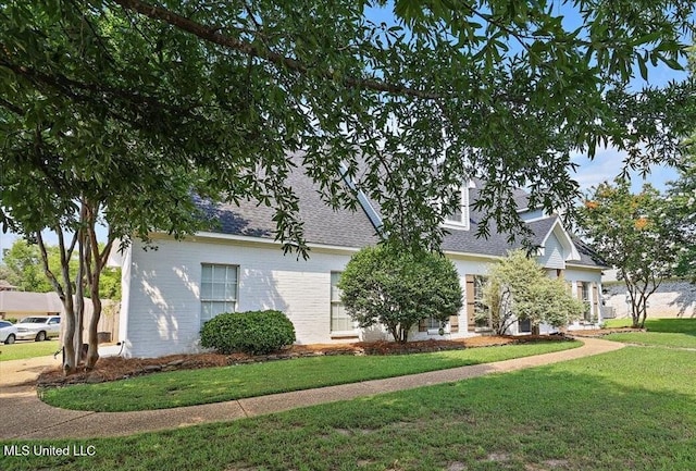 449 Abbey Woods, Brandon, MS 39047 - obstructed view of property featuring a front yard and a shingled roof