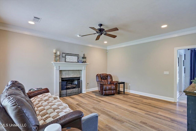 449 Abbey Woods, Brandon, MS 39047 - living room featuring a ceiling fan, crown molding, light wood finished floors, a fireplace, and recessed lighting