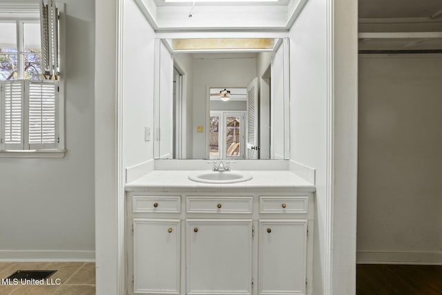 bathroom featuring vanity, tile patterned floors, and ceiling fan