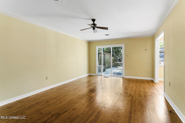 spare room featuring ceiling fan, ornamental molding, and wood-type flooring