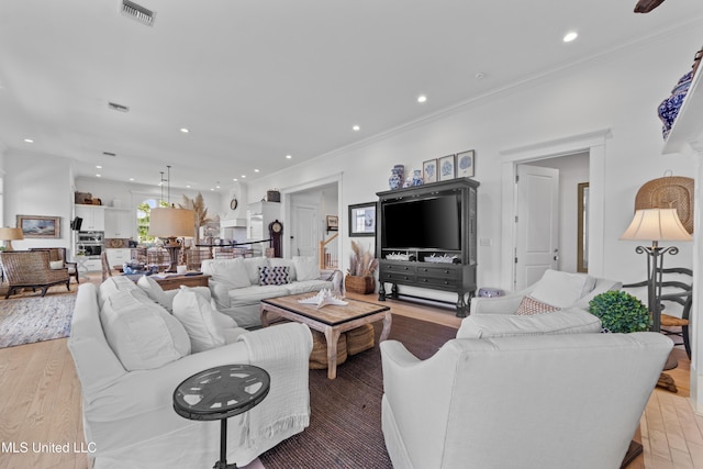 1221 E Beach Blvd, Pass Christian, MS 39571 - living area with recessed lighting, light wood-style flooring, and ornamental molding