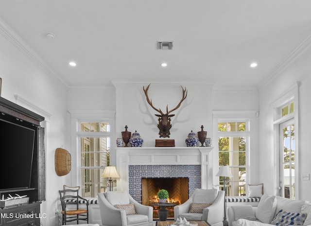 1221 E Beach Blvd, Pass Christian, MS 39571 - living room featuring healthy amount of natural light, a fireplace, ornamental molding, and recessed lighting