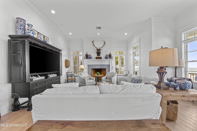 1221 E Beach Blvd, Pass Christian, MS 39571 - living room featuring wood finished floors, a fireplace, ornamental molding, and recessed lighting