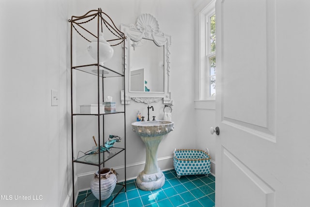 1221 E Beach Blvd, Pass Christian, MS 39571 - bathroom featuring baseboards and tile patterned floors