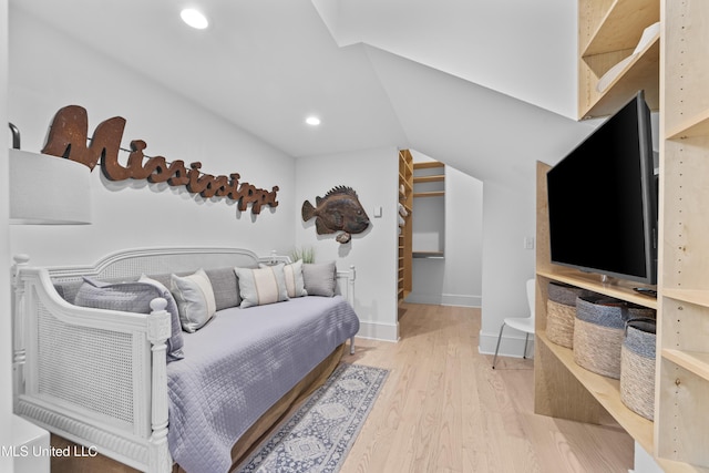 1221 E Beach Blvd, Pass Christian, MS 39571 - bedroom with wood finished floors, recessed lighting, vaulted ceiling, and baseboards