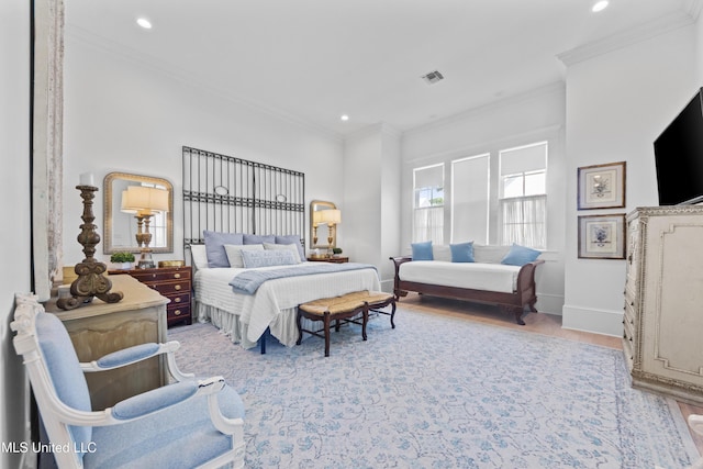 1221 E Beach Blvd, Pass Christian, MS 39571 - bedroom with crown molding, recessed lighting, wood finished floors, and baseboards