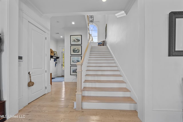 1221 E Beach Blvd, Pass Christian, MS 39571 - staircase with ornamental molding, wood finished floors, recessed lighting, and baseboards