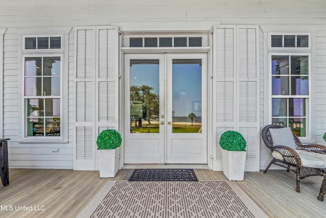 1221 E Beach Blvd, Pass Christian, MS 39571 - doorway to property with french doors and a wooden deck