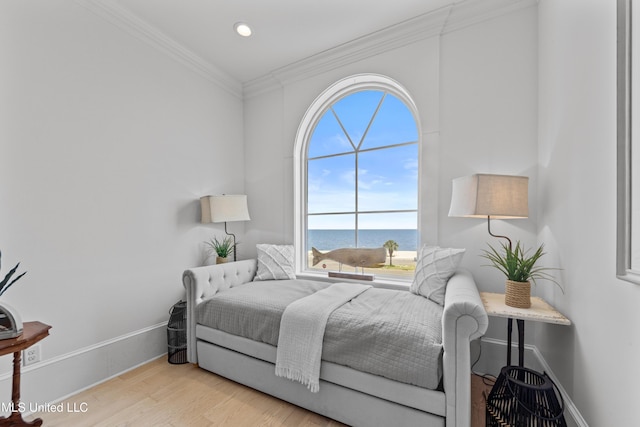 1221 E Beach Blvd, Pass Christian, MS 39571 - bedroom featuring a water view, multiple windows, crown molding, wood finished floors, and baseboards