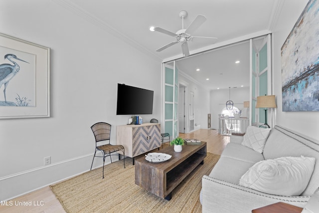 1221 E Beach Blvd, Pass Christian, MS 39571 - living room with wood finished floors, a ceiling fan, ornamental molding, and recessed lighting