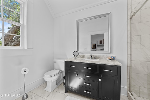 1221 E Beach Blvd, Pass Christian, MS 39571 - bathroom with crown molding, toilet, vanity, a tile shower, and baseboards