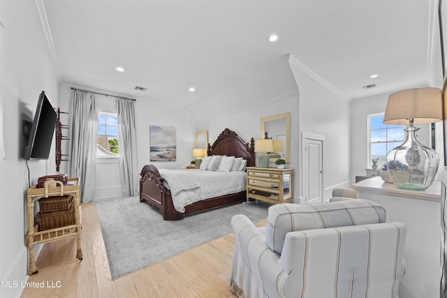1221 E Beach Blvd, Pass Christian, MS 39571 - bedroom featuring ornamental molding, multiple windows, light wood-style floors, baseboards, and recessed lighting