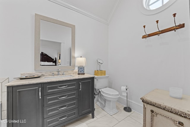1221 E Beach Blvd, Pass Christian, MS 39571 - bathroom with crown molding, vanity, toilet, marble look tile flooring, and baseboards