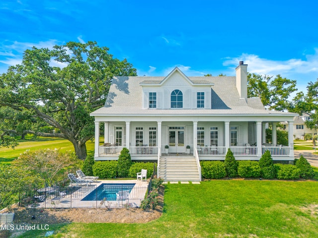 1221 E Beach Blvd, Pass Christian, MS 39571 - back of property featuring a yard, a chimney, a patio, and french doors