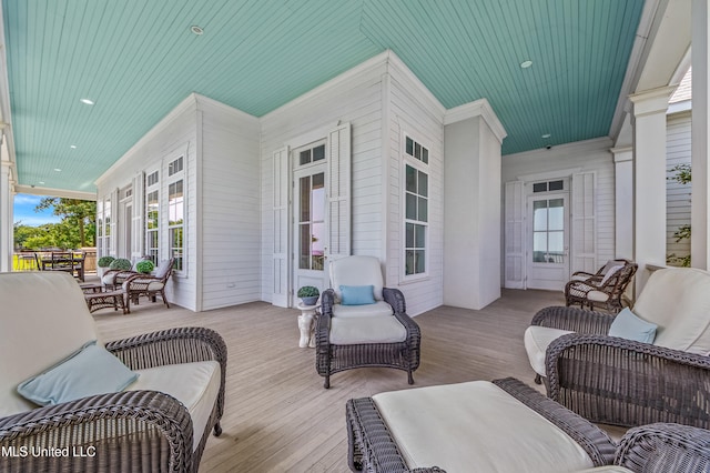 1221 E Beach Blvd, Pass Christian, MS 39571 - wooden porch featuring an outdoor living space