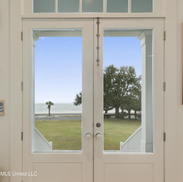1221 E Beach Blvd, Pass Christian, MS 39571 - doorway to outside featuring a water view, french doors, and healthy amount of natural light