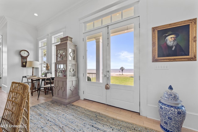 1221 E Beach Blvd, Pass Christian, MS 39571 - entrance foyer featuring ornamental molding, healthy amount of natural light, wood finished floors, baseboards, and recessed lighting