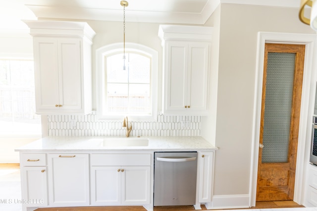 kitchen with sink, dishwasher, decorative backsplash, and white cabinets