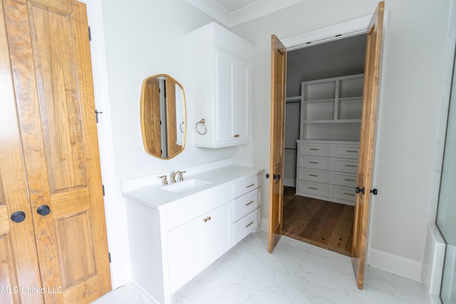 bathroom featuring vanity and ornamental molding