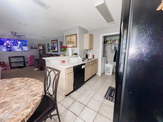 5080 Gautier Vancleave Rd Unit D-8, Gautier, MS 39553 - kitchen featuring black appliances, cream cabinets, light tile patterned floors, and a ceiling fan