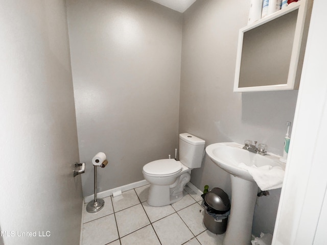 5080 Gautier Vancleave Rd Unit D-8, Gautier, MS 39553 - half bathroom featuring toilet, tile patterned floors, and baseboards