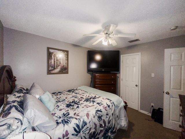 5080 Gautier Vancleave Rd Unit D-8, Gautier, MS 39553 - carpeted bedroom featuring a ceiling fan and a textured ceiling
