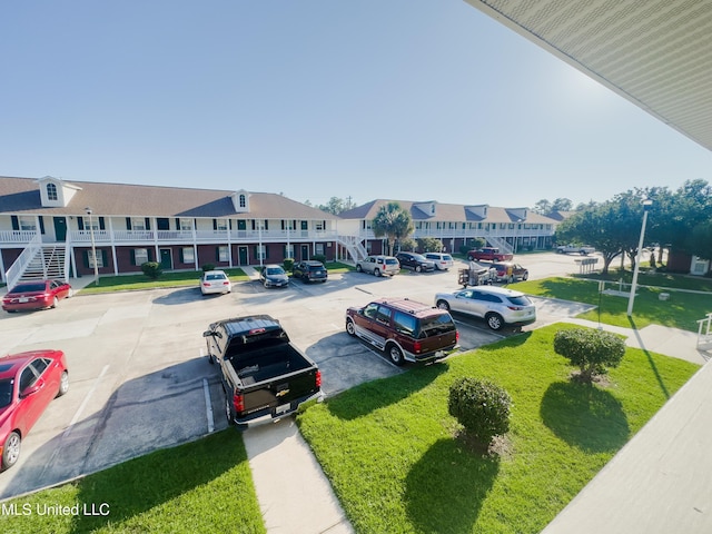 5080 Gautier Vancleave Rd Unit D-8, Gautier, MS 39553 - uncovered parking lot featuring a residential view
