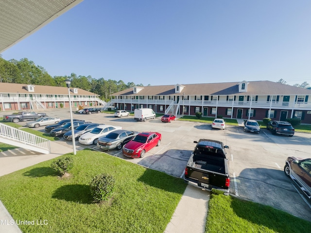 5080 Gautier Vancleave Rd Unit D-8, Gautier, MS 39553 - uncovered parking lot featuring a residential view