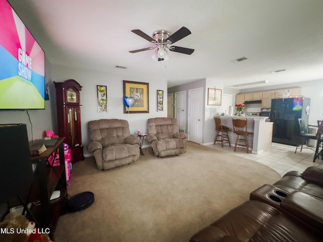 5080 Gautier Vancleave Rd Unit D-8, Gautier, MS 39553 - living room featuring a ceiling fan, light colored carpet, and light tile patterned floors