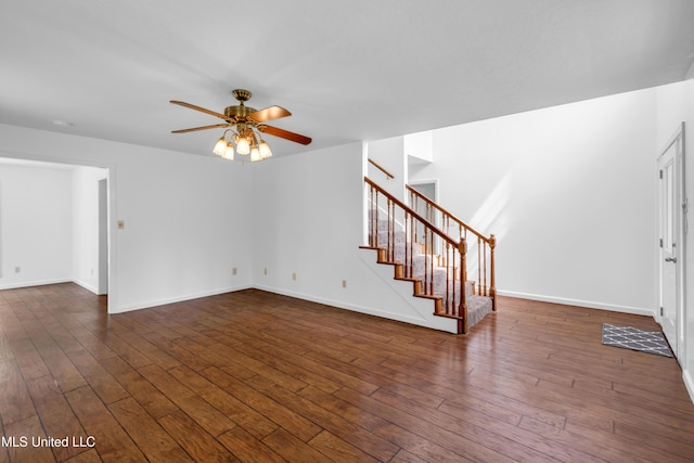 16609 Old River Rd, Vancleave, MS 39565 - unfurnished living room featuring a ceiling fan, stairway, dark wood-style flooring, and baseboards