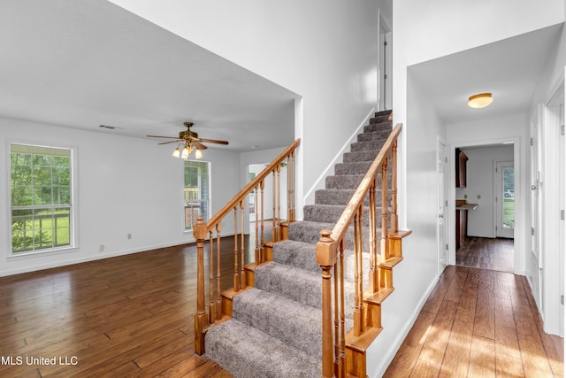 16609 Old River Rd, Vancleave, MS 39565 - stairway with hardwood / wood-style flooring, healthy amount of natural light, a ceiling fan, and baseboards