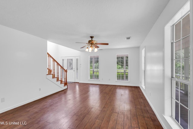 16609 Old River Rd, Vancleave, MS 39565 - unfurnished living room with a ceiling fan, stairway, baseboards, and dark wood-type flooring
